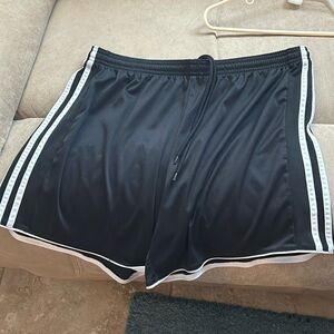 Women’s traditional Adidas black with white stripes athletic shorts